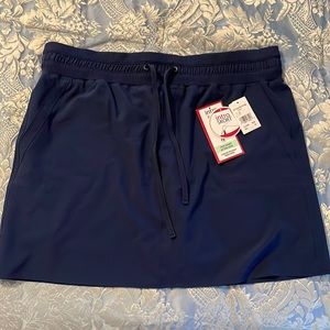 New! Intro stretch skort, size 16, navy blue with two front and back pockets.